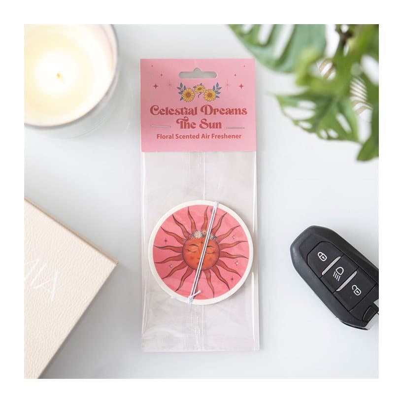 Paper celestial sun car air freshener on a cardboard back with a Euro hook