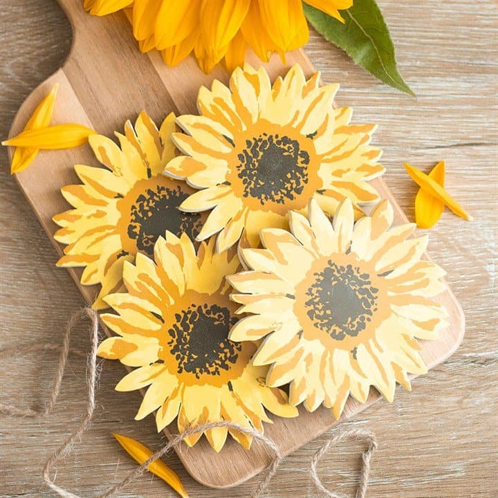 Four sunflower-shaped coasters tied together with rustic rope