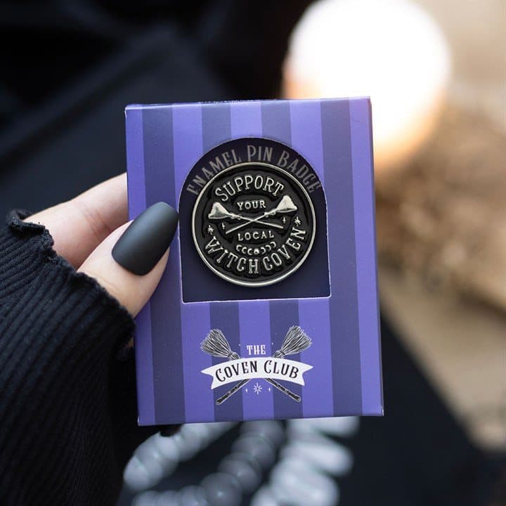 Enamel pin badge with crossed broomsticks and a witch coven phrase