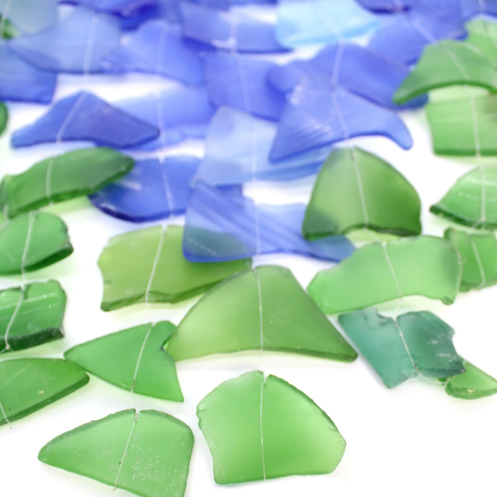Blue and green glass and wood wind chime with three sticks