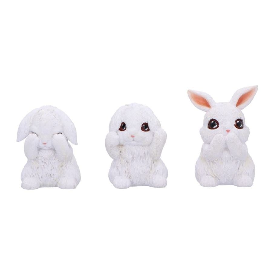 Three white bunny figurines covering eyes, ears and mouth