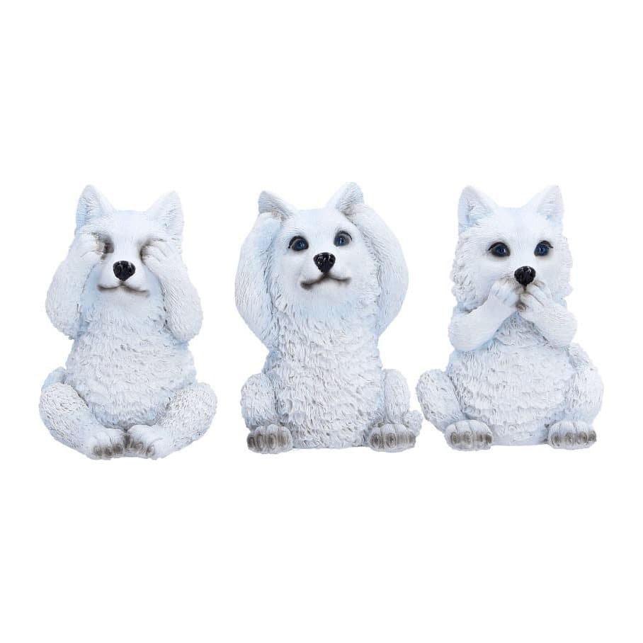 Three snow-white wolf cub figurines in see no, hear no and speak no evil poses