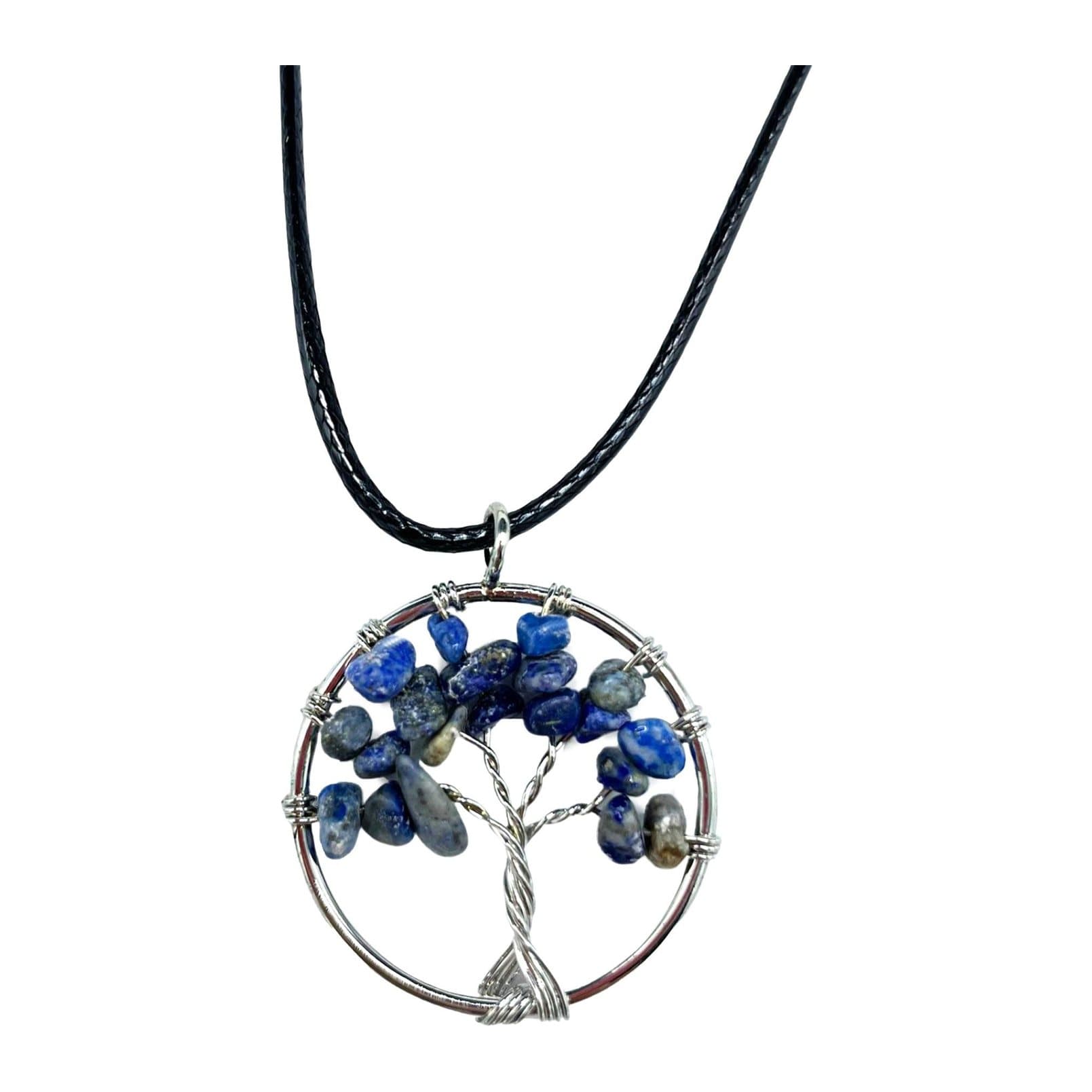 Sodalite tree of life pendant with a deep blue gemstone and white marbling