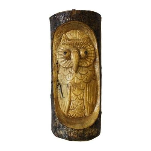 Carved tree trunk with an owl