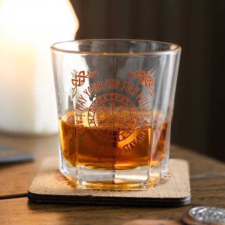 Lowball whisky glass with a Viking compass design on a cork coaster