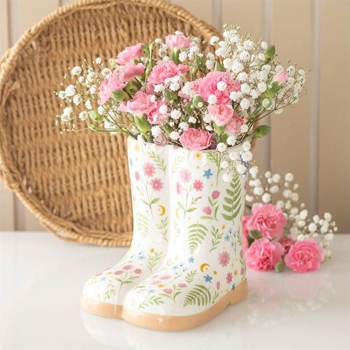Welly boot shaped plant pot in a floral print, a light green and a dark green design