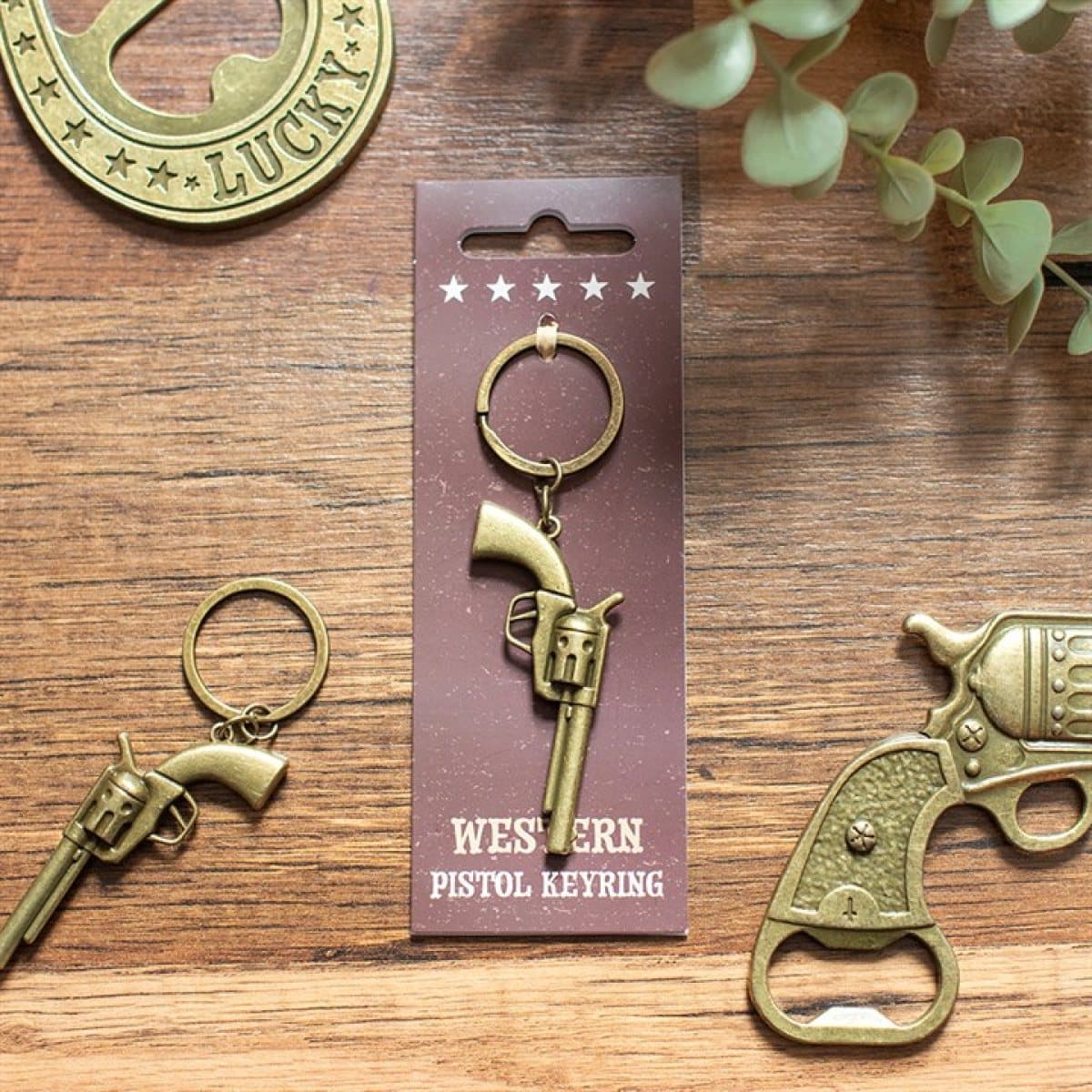 Western pistol alloy keyring on a cardboard back