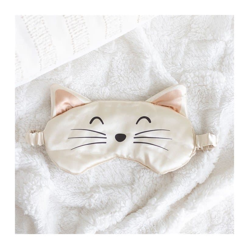 White satin eye mask with printed cat face details and an elastic strap