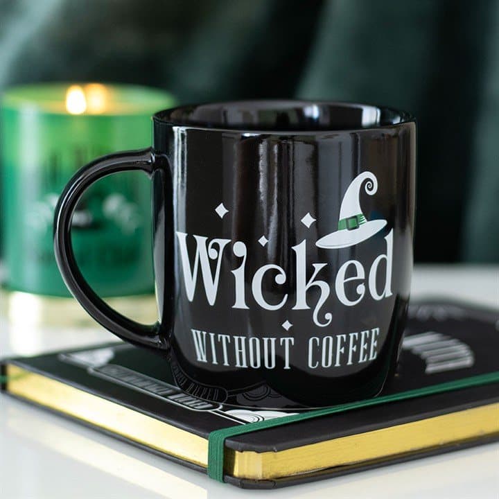 Ceramic mug with a pointed witch hat design and Wicked Without Coffee text