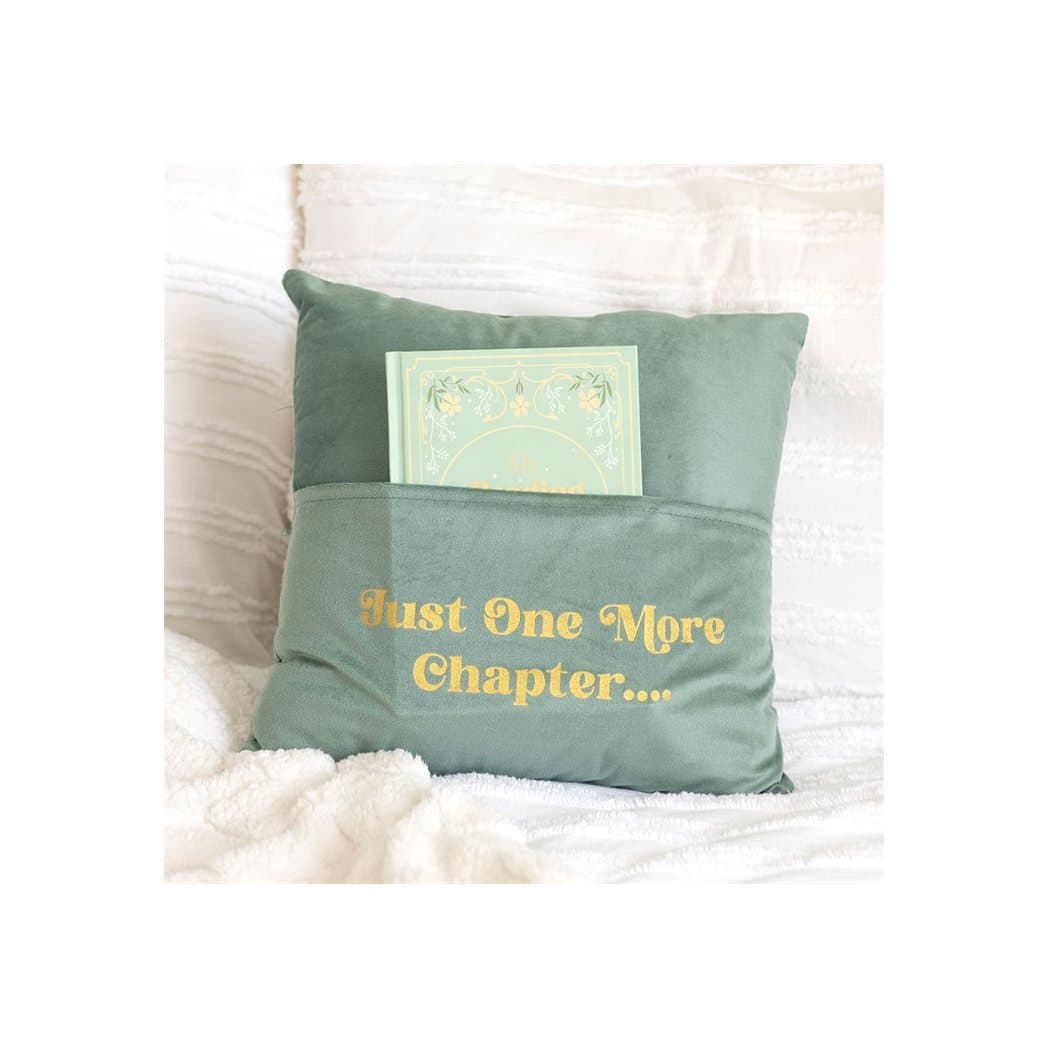 Pale green square cushion with 'Just One More Chapter' text and a front pocket