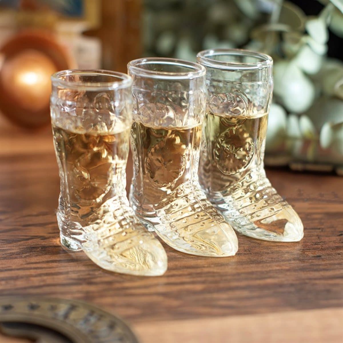 Set of 3 glass cowboy boot shot glasses shown with their colour cardboard box