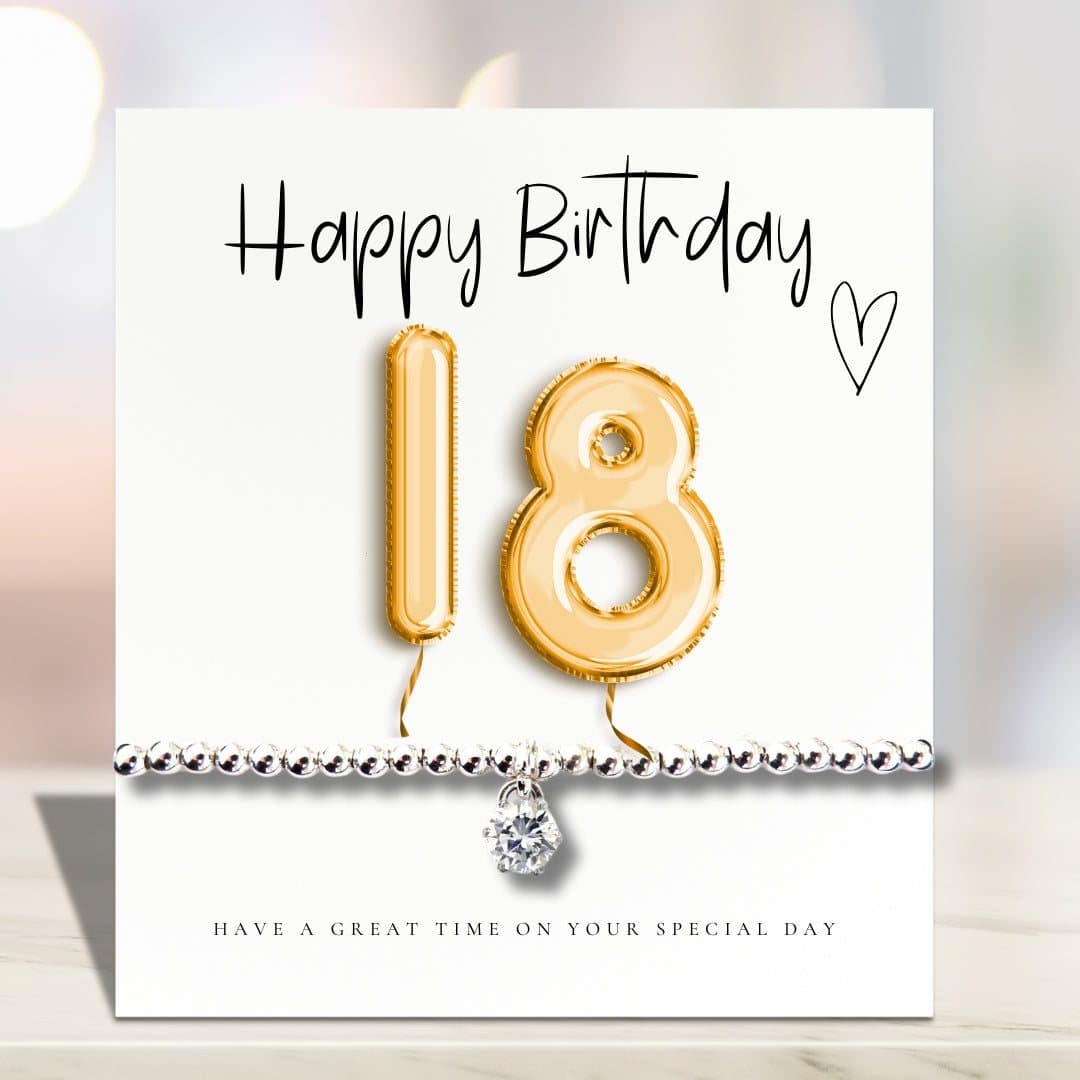 Silver stretch bracelet with cubic zirconia charm and gold balloons card