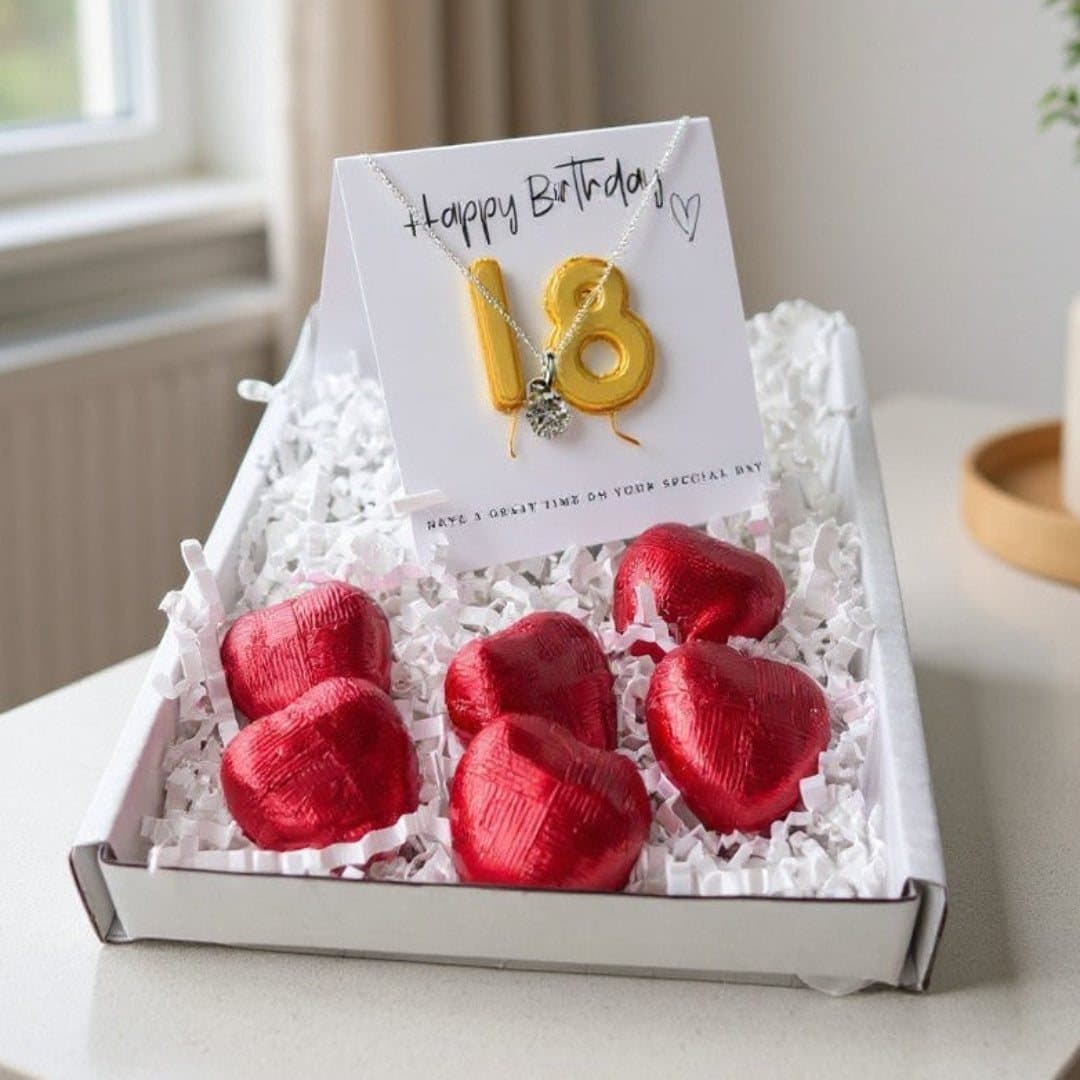 18th birthday gift box with a heart necklace, gold balloons and chocolate hearts