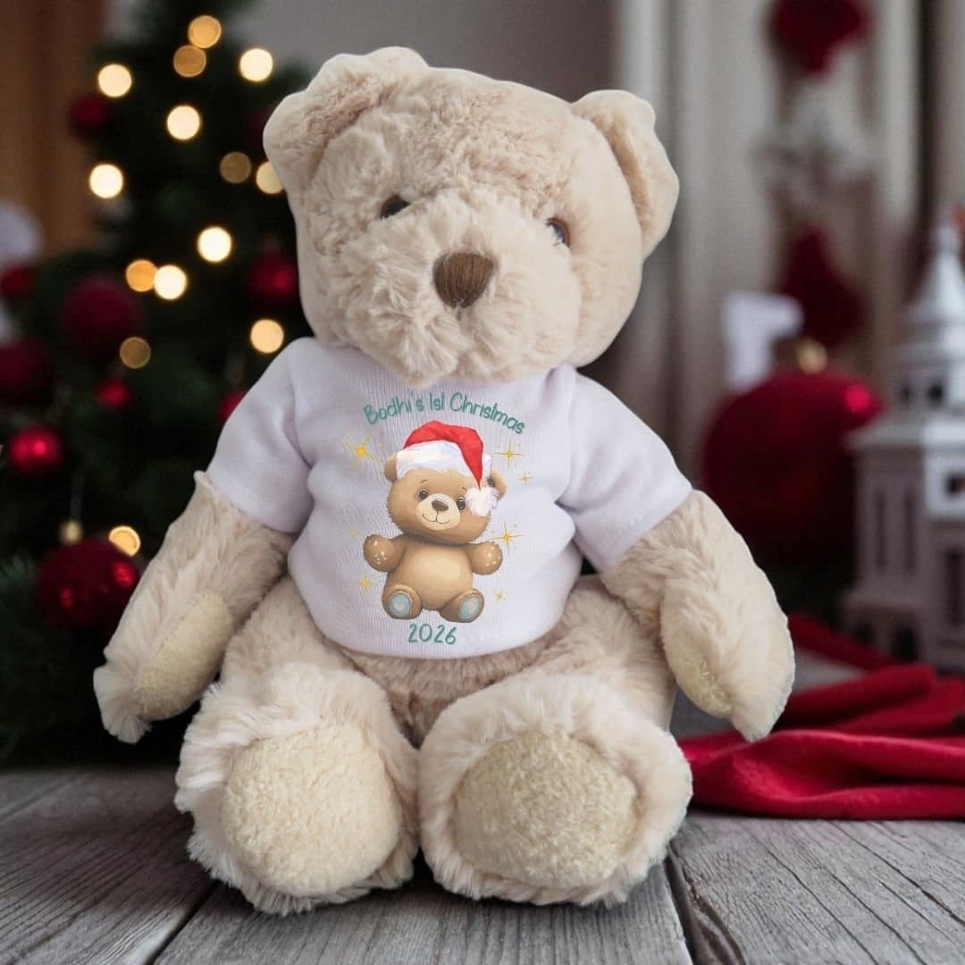 Personalised teddy bear wearing a T-shirt with the Happy 1st Christmas design