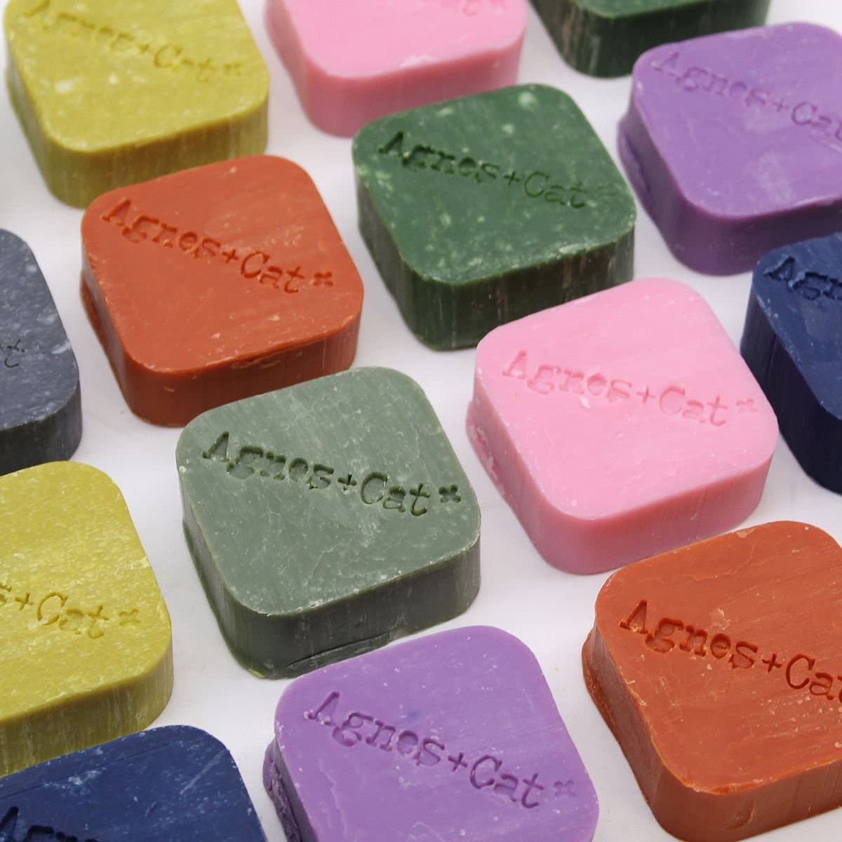 Pressed Peonies solid shampoo bar in embossed packaging