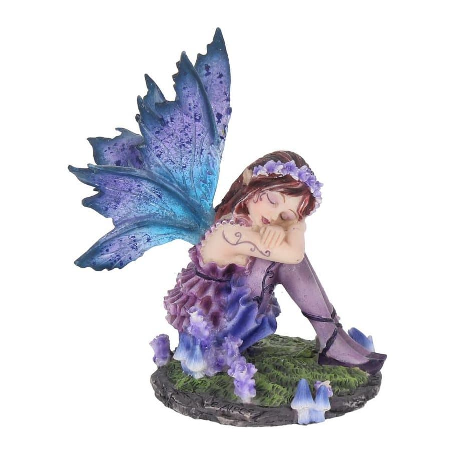 Akina fairy figurine in a purple dress with large wings sitting on green ground