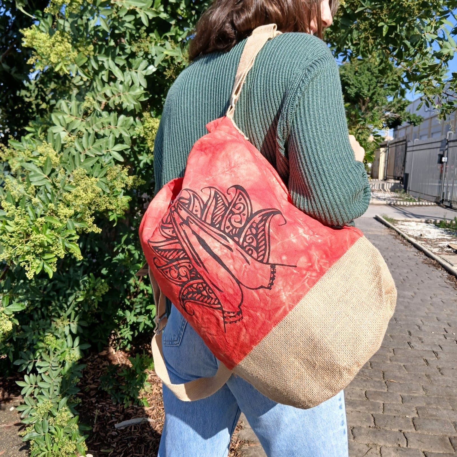 Orange stonewash cotton canvas backpack with a Namaste Hand symbol