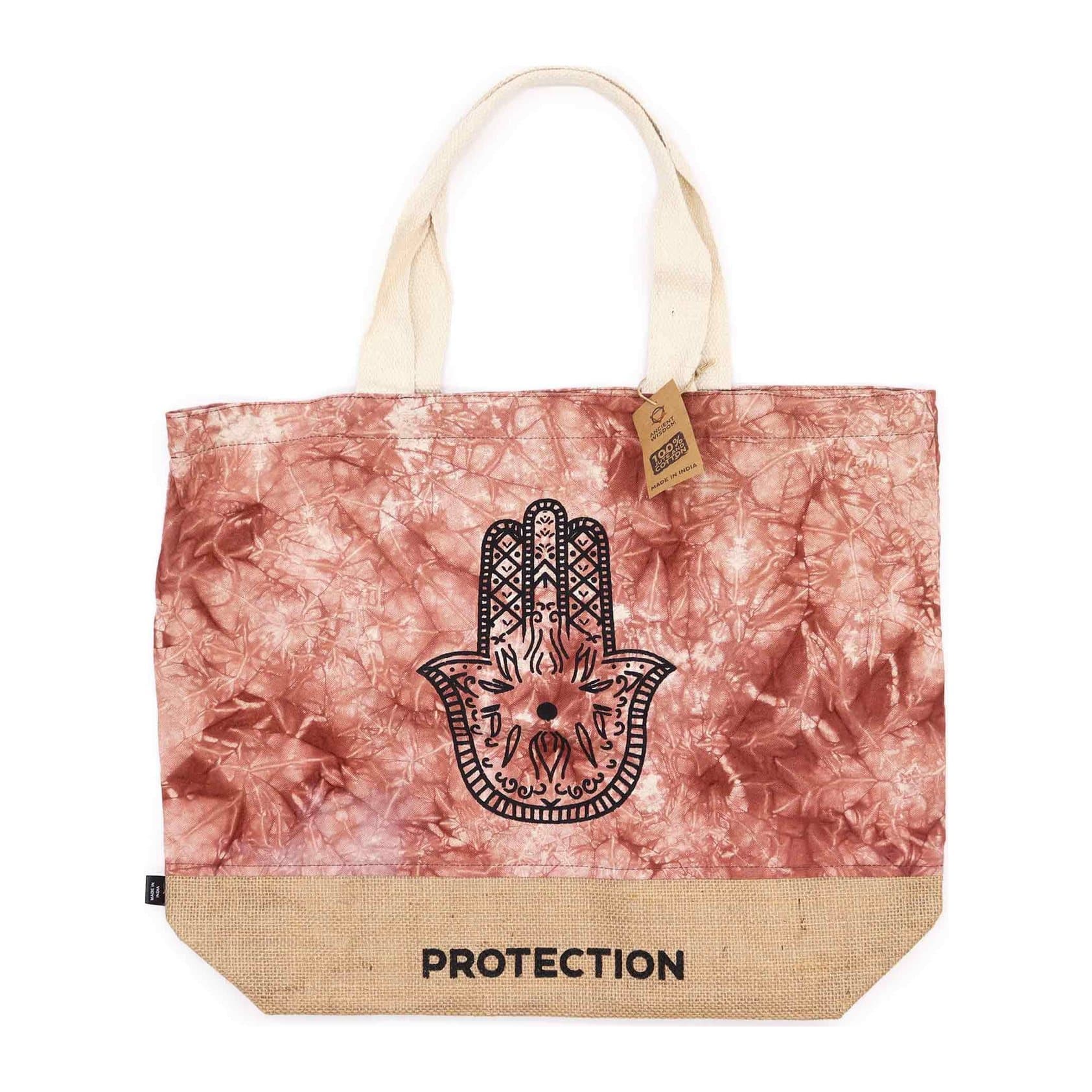 Terracotta stonewash tote bag with a Hamsa hand symbol and bold lettering on the front