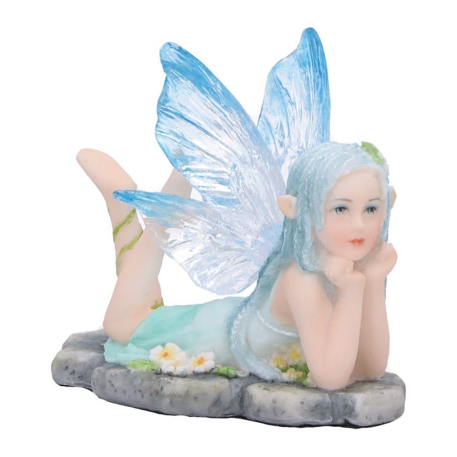 Amelia nature fairy figurine with clear blue wings, resting on a rock among flowers