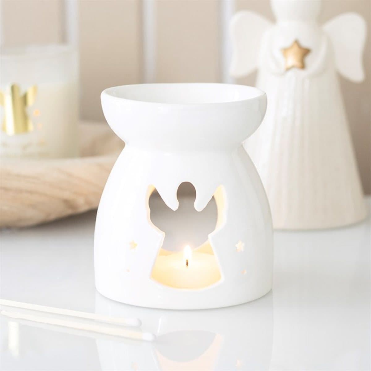 Ceramic oil burner with angel-shaped cut-out