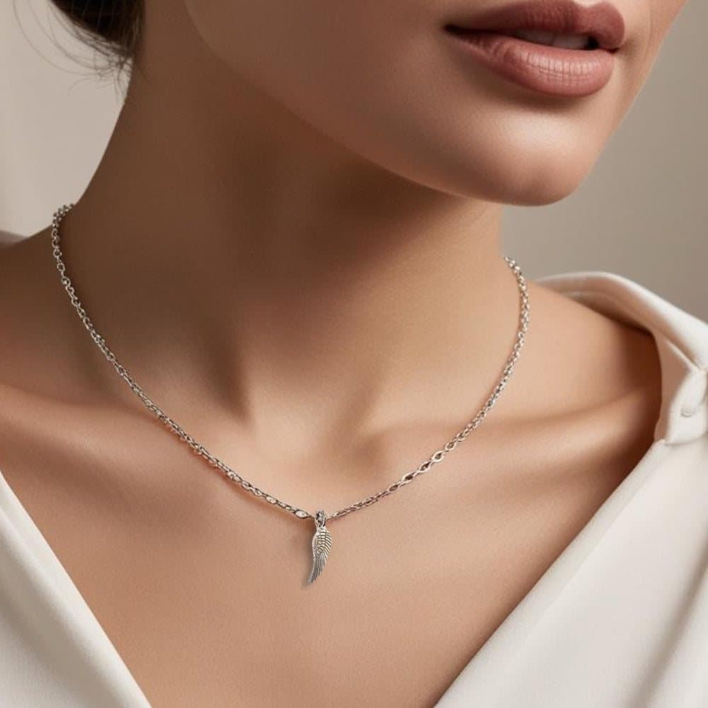 Silver angel feather necklace with an angel wing charm on a chain