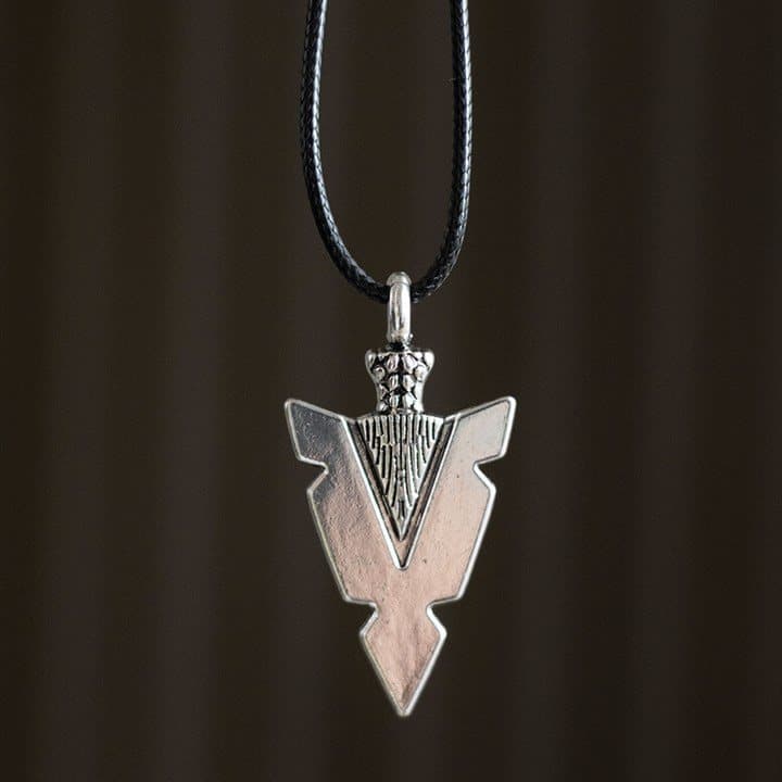 Arrowhead of Strength alloy pendant necklace on a black cord on a cardboard backing