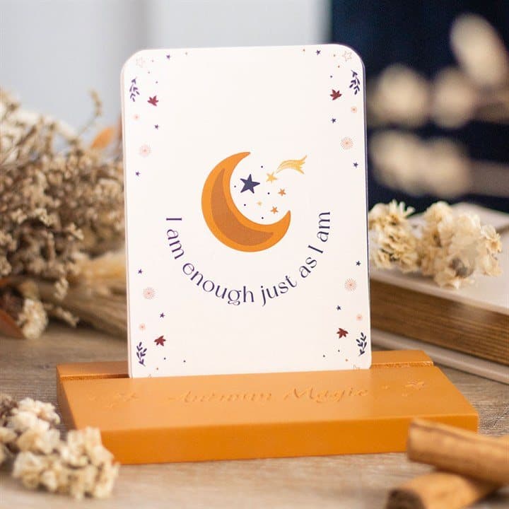 Affirmation cards displayed on a wooden stand