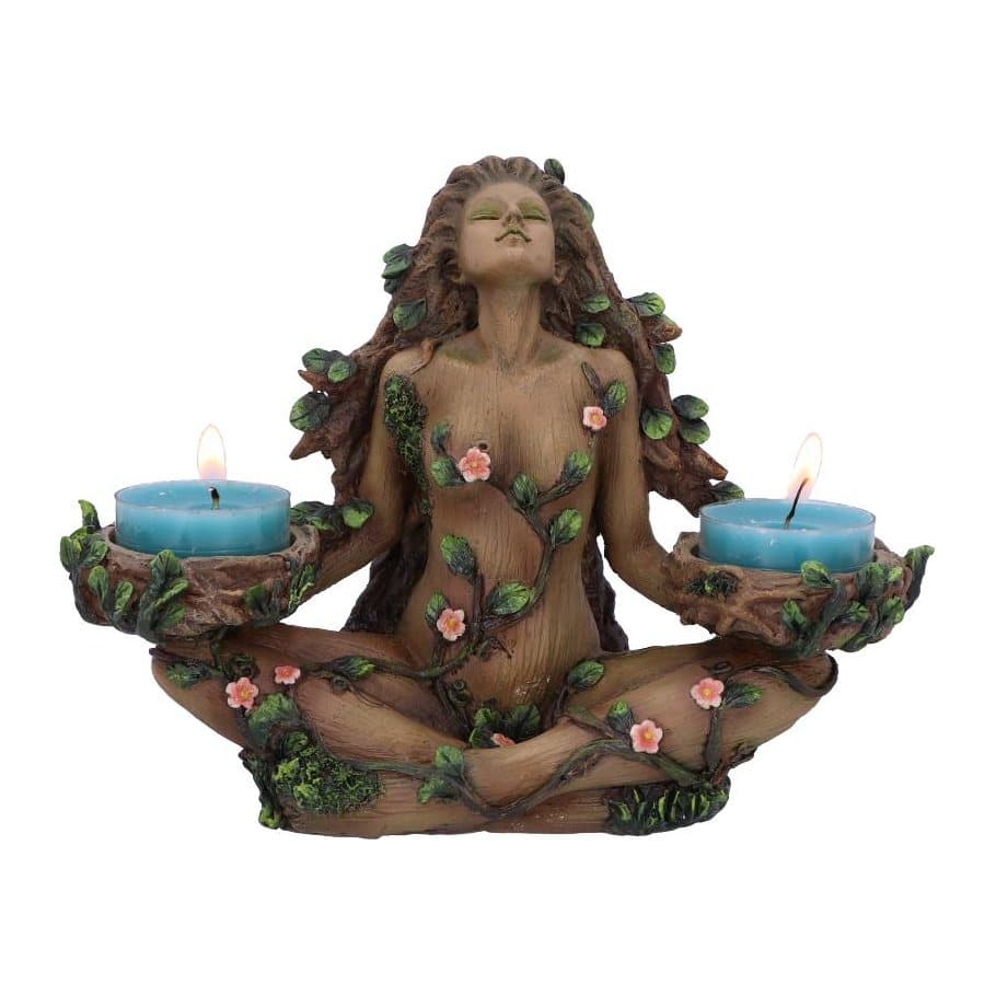 Female tree spirit figure with branches and leaves holding two tealights