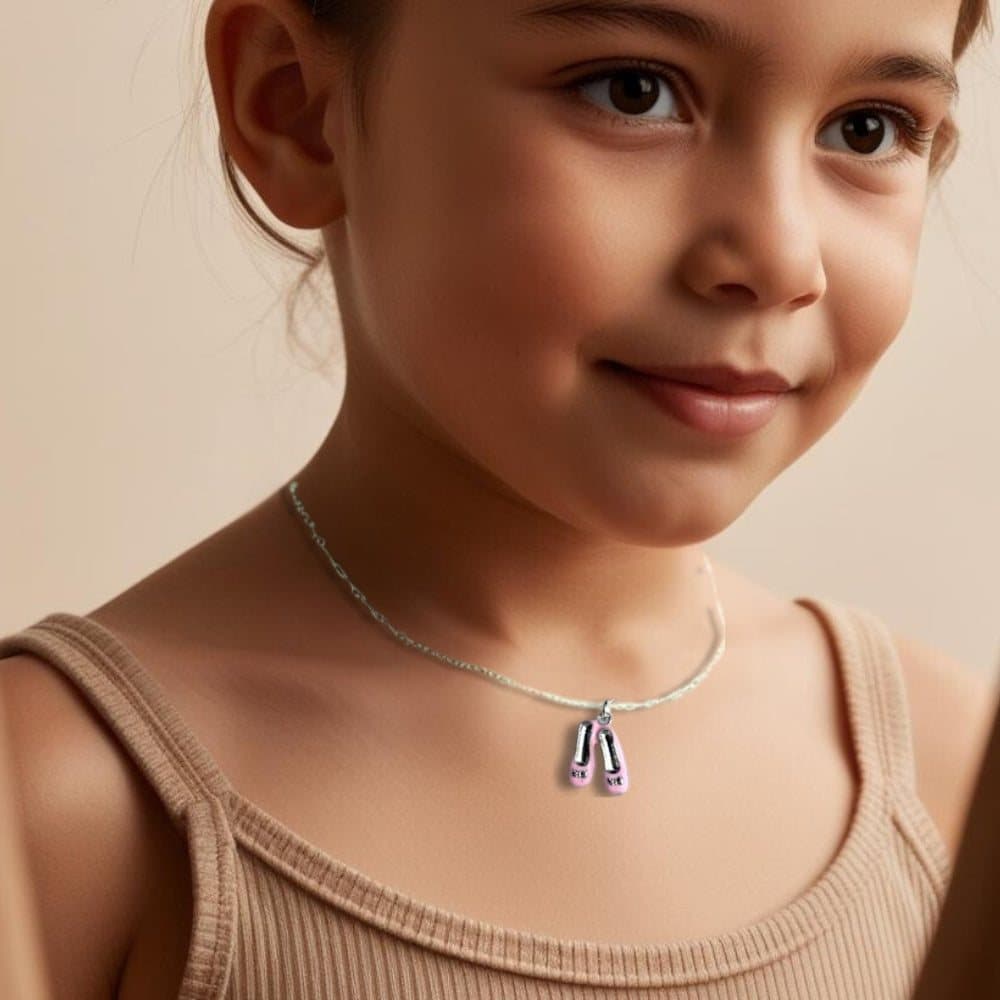 Pink ballet shoes charm necklace with a pink square jewellery box and gift card.