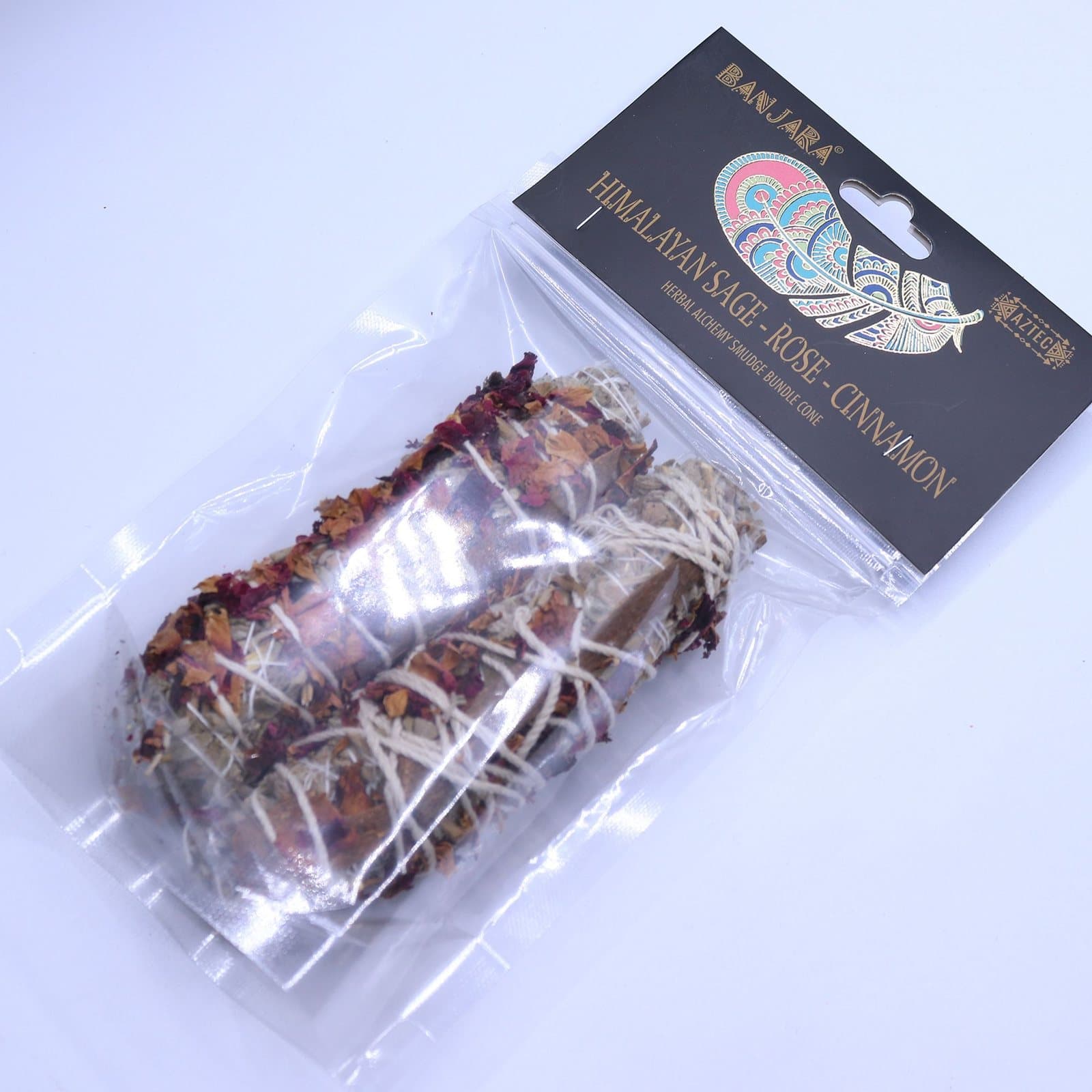 Smudge bundle of sage, rose petals and cinnamon bound with natural thread