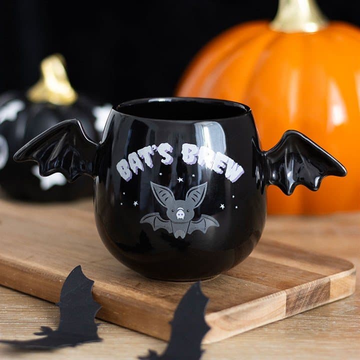 Ceramic mug with bat wings on a spooky goth style design