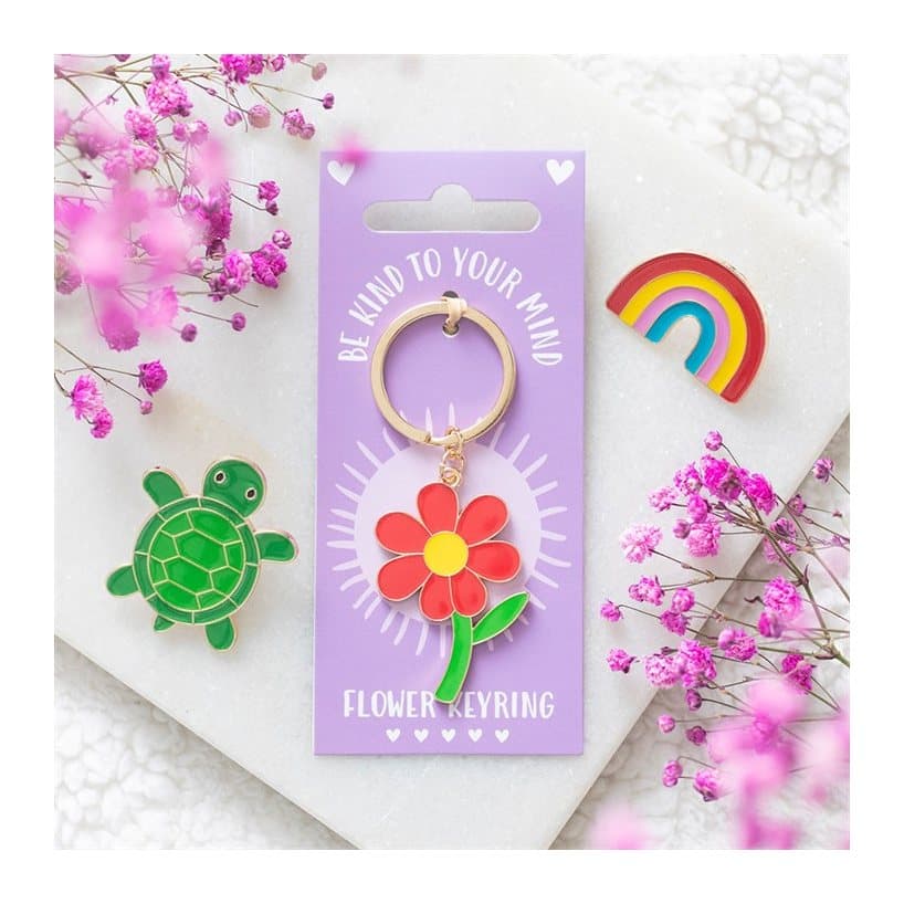 Be Kind to Your Mind flower keyring on its cardboard back