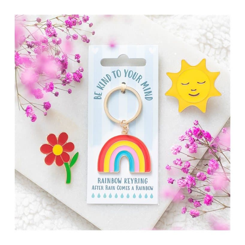 Be Kind to Your Mind rainbow-shaped keyring on its cardboard back