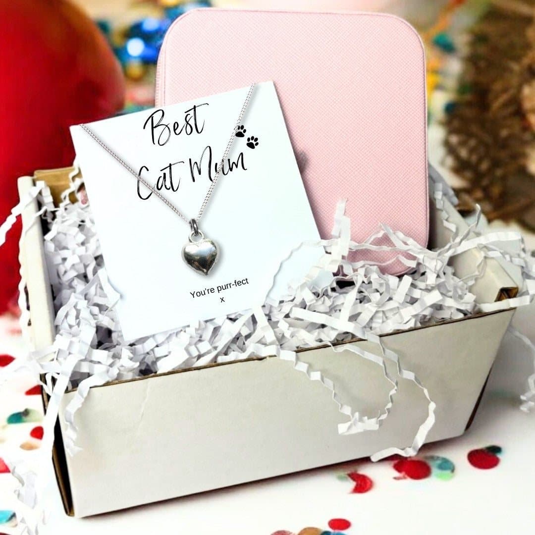 Silver puff heart necklace beside a pink jewellery box and a Best Cat Mum card