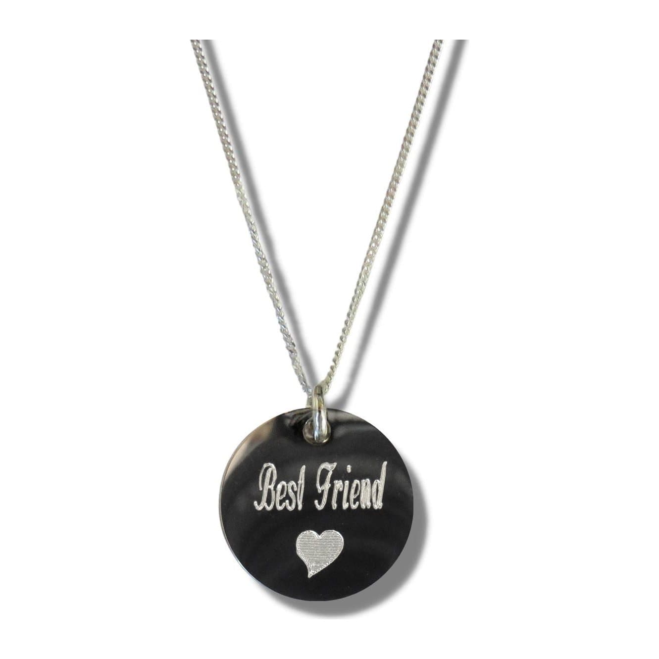 Silver disc necklace engraved with Best Friend and a heart symbol on a chain