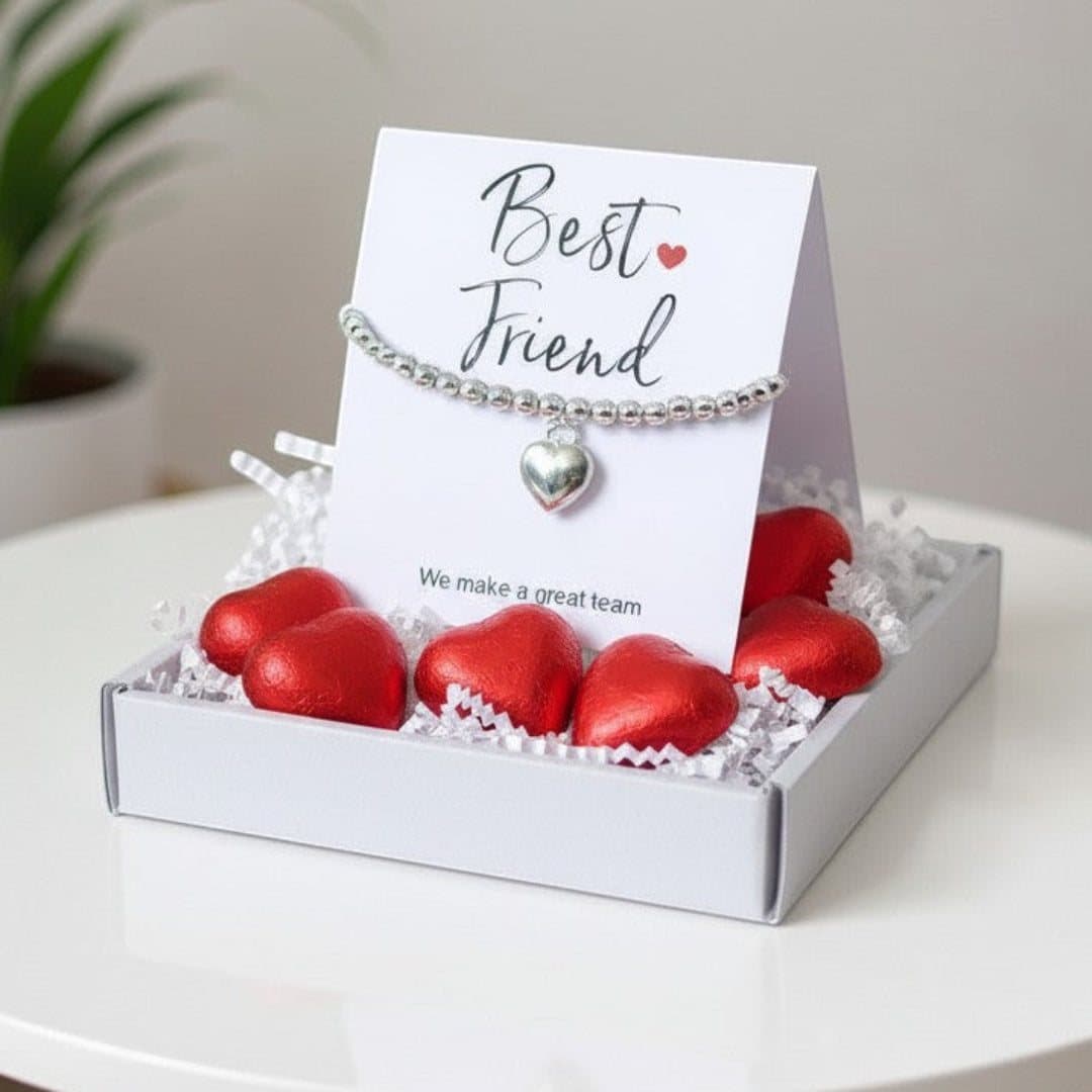 Silver heart bracelet and red foiled chocolate hearts in a best friend gift