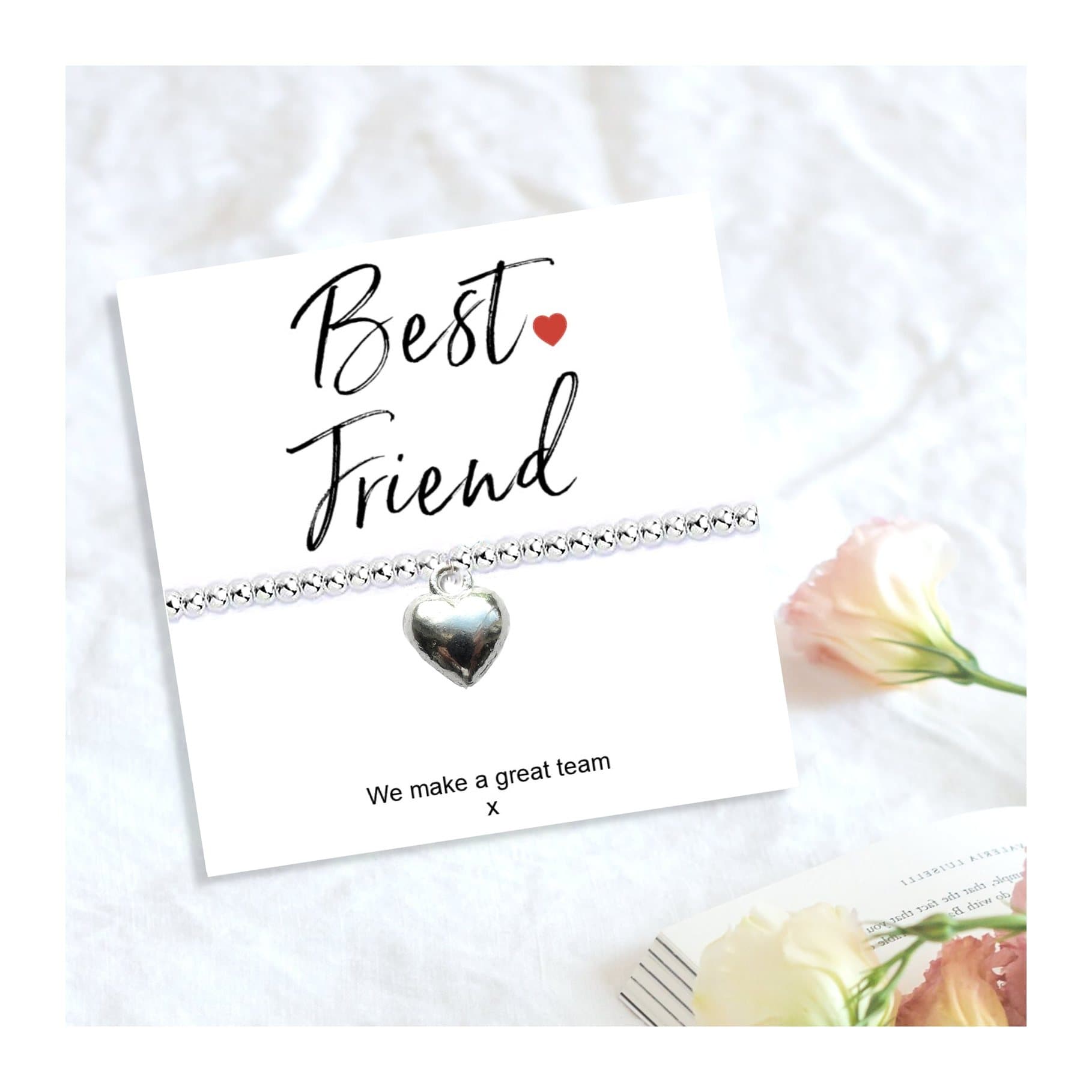 Silver heart stretch beaded bracelet on a We Make A Great Team card