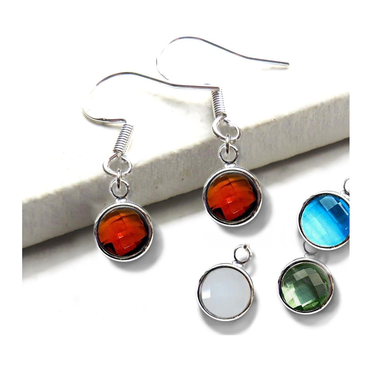 Silver plated birthstone drop earrings with a faceted coloured glass stone