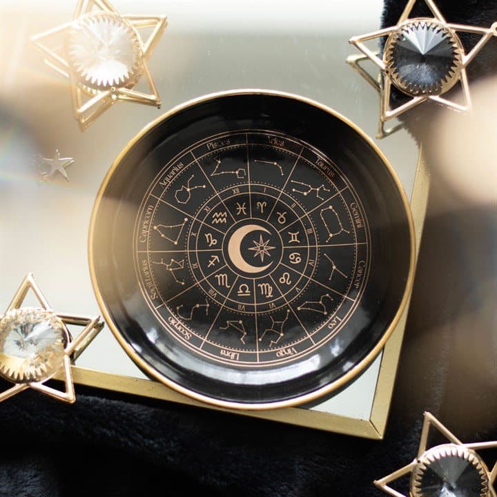 Black ceramic trinket dish with a gold effect astrology wheel
