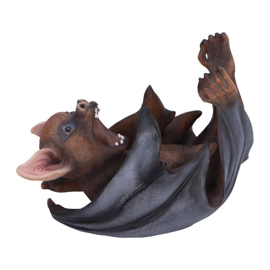 Black bat figurine holding a wine bottle to its mouth