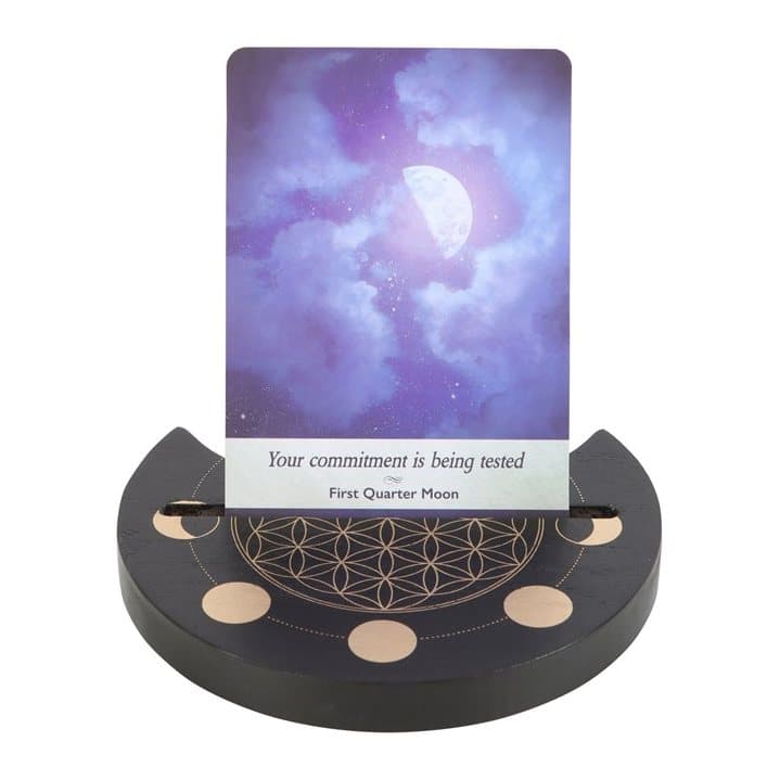 Black tarot card stand with a Flower of Life design