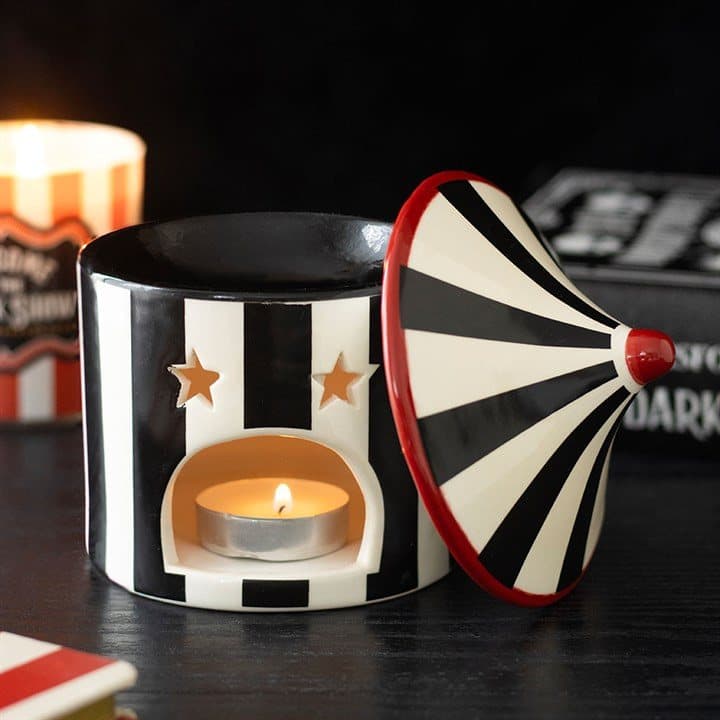 Black striped ceramic oil burner designed like a twisted circus tent