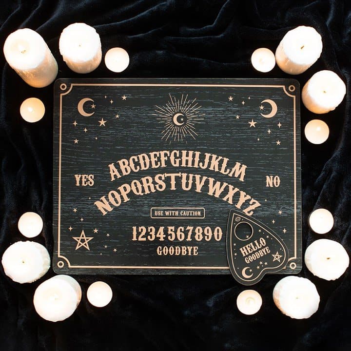Black talking board with planchette