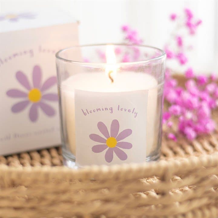 Wildflower candle with a purple and yellow daisy design and Blooming Lovely text