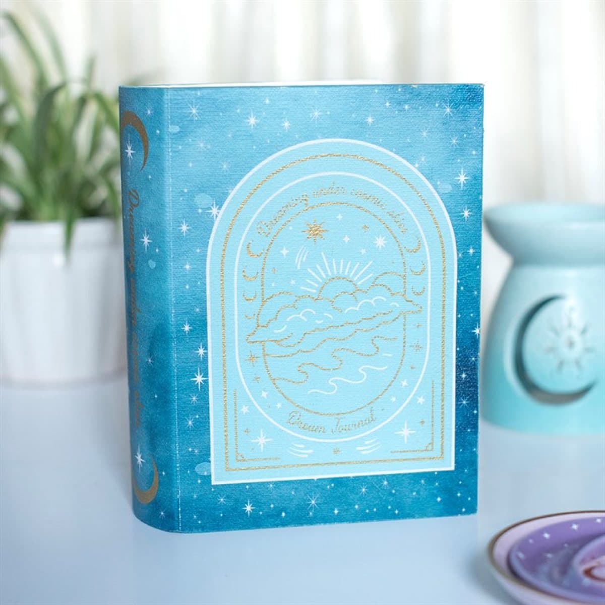 Blue celestial hardback style storage box with moon and star details