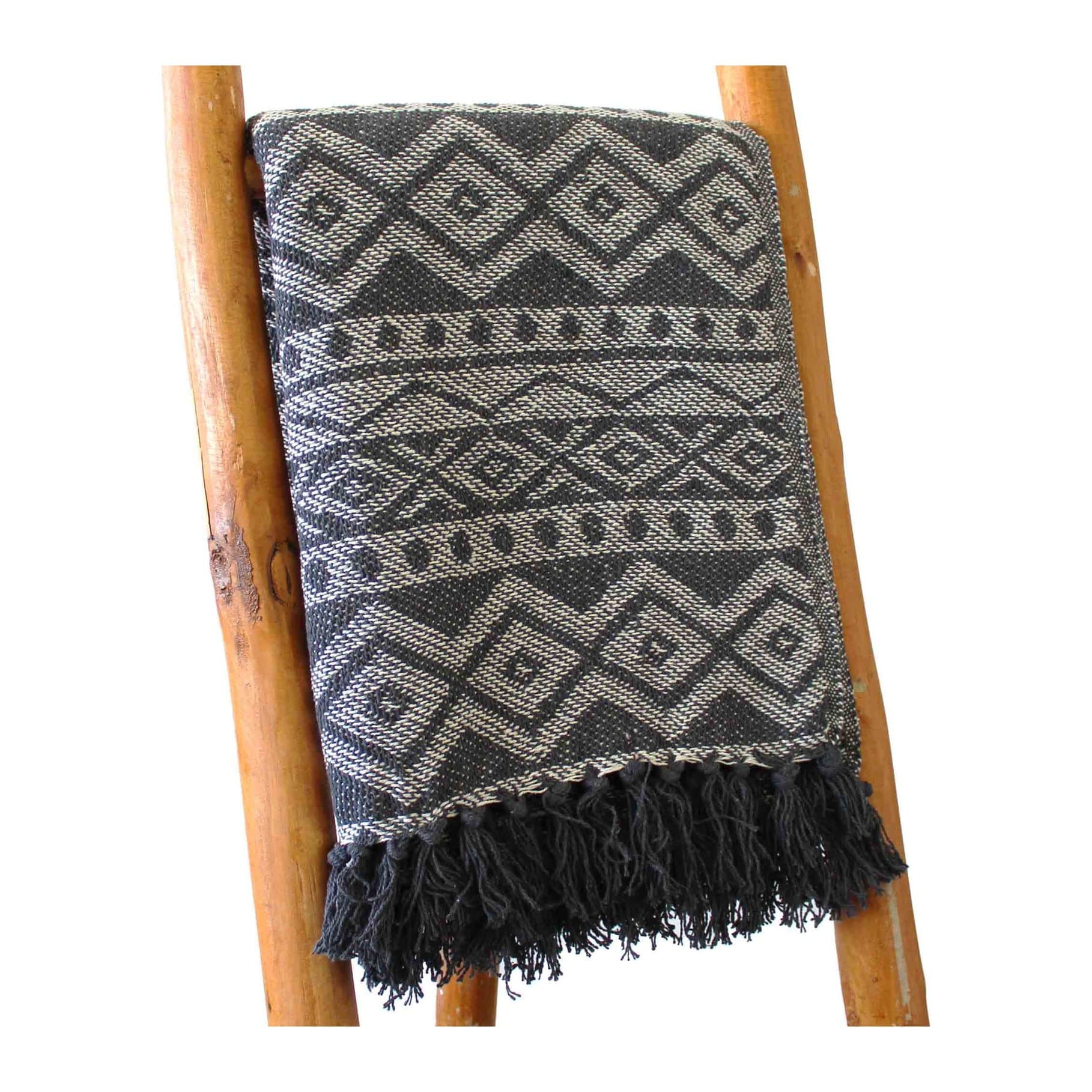 Grey geometric cotton throw with diamond motifs and dark tassel fringe