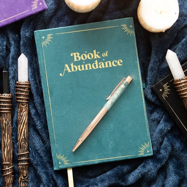 Green Book of Abundance journal with gold detailing and an aventurine pen