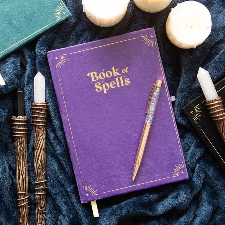 Purple Book of Spells journal with a crystal pen
