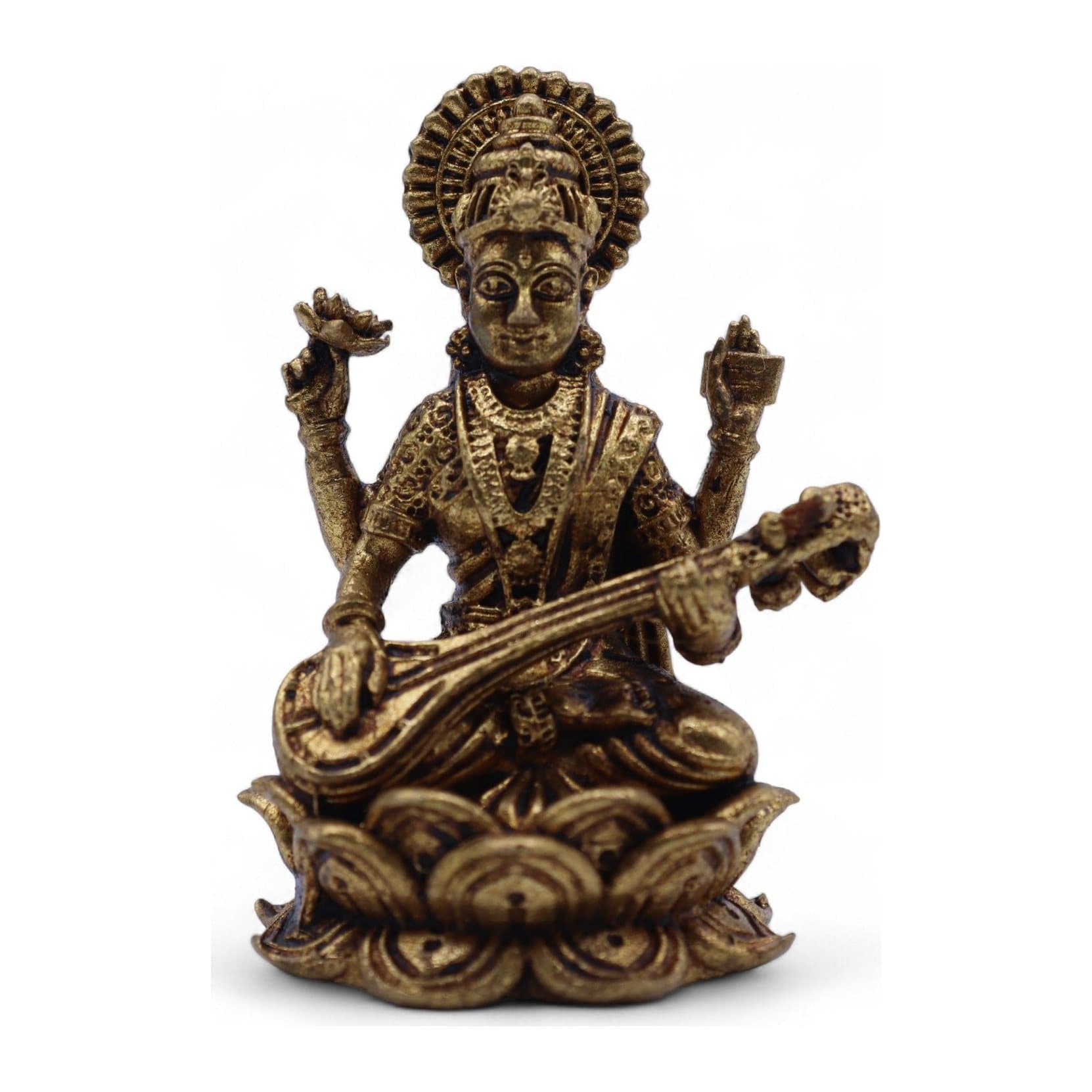 Small brass Goddess Saraswati seated on a lotus holding a veena