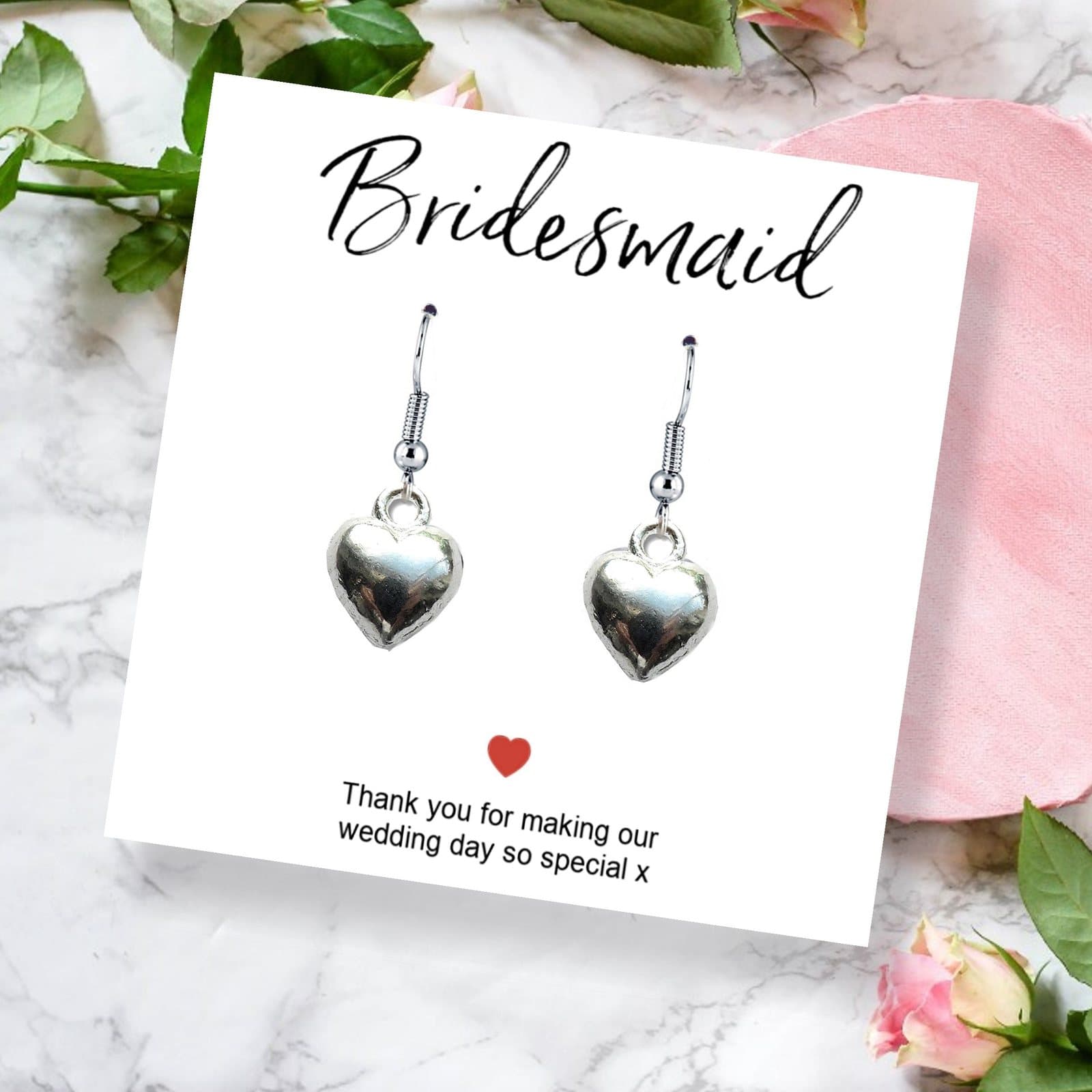 Silver heart earrings with a thank you card, shown with a black gift box